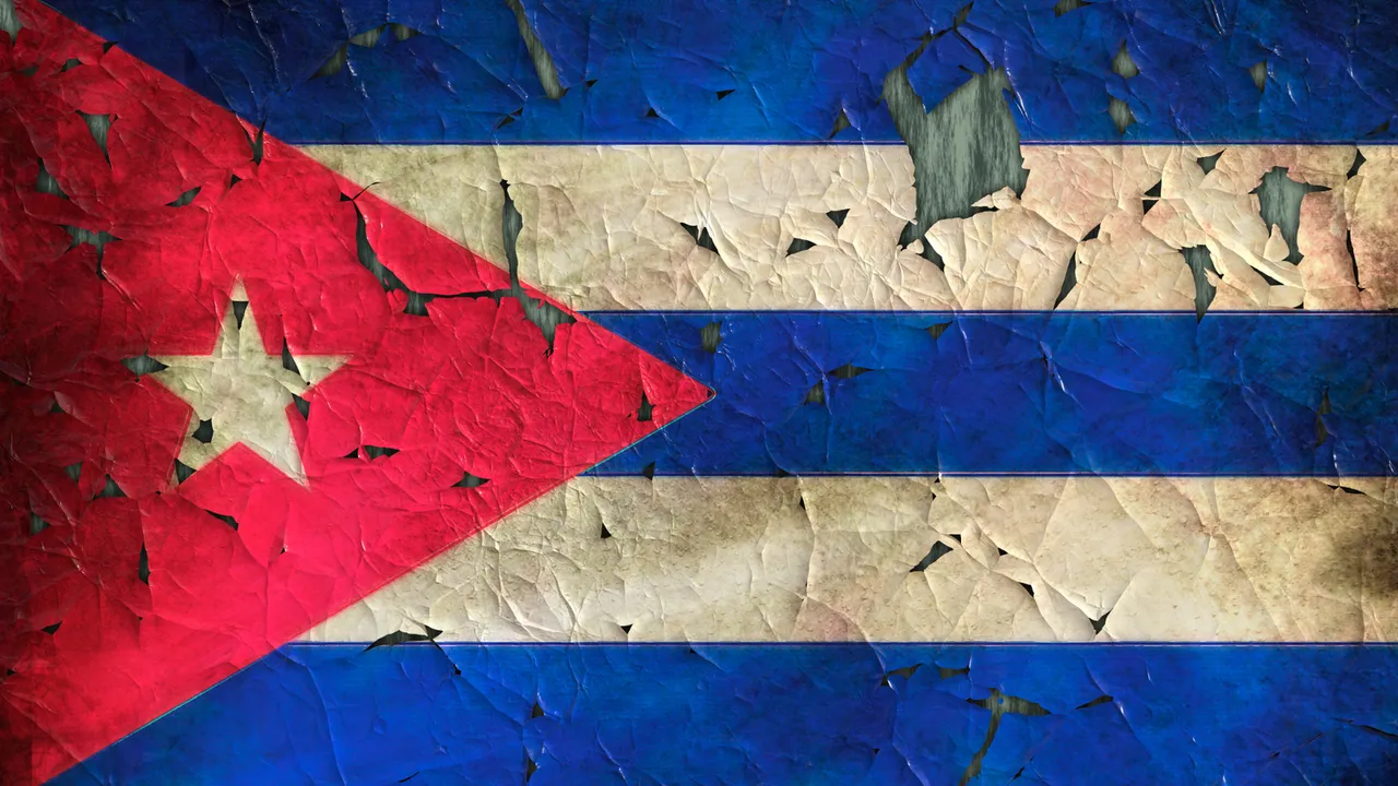 drawing of the Cuban flag on a peeling wall