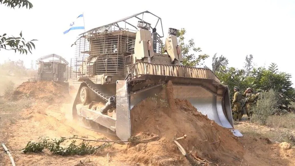Buldozer che abbattono alberi